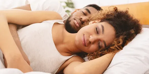 couple sleeping peacefully in bed bug free bed